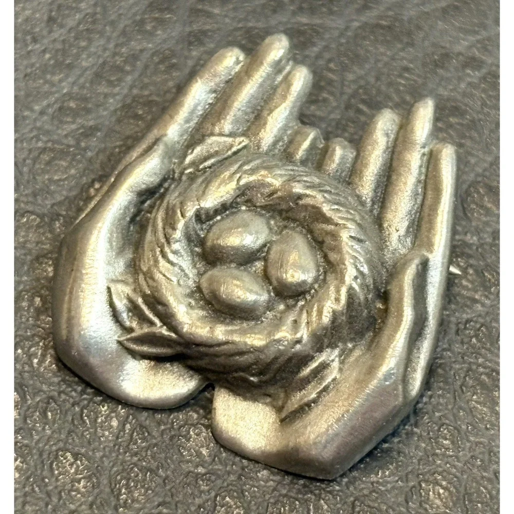Vintage 1989 GUYOT Pewter Hands Holding Birds Nest With Eggs Brooch Pin